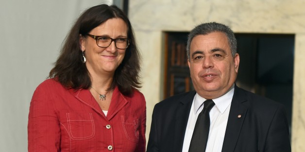 Eurpean Trade Commissioner Cecilia Malmstroem shakes hands with Tunisia's Trade Minister Ridha Lahouel during their meeting on October 13, 2015 in Tunis. Malmstroem began talks in Tunisia towards a free trade deal with Europe, part of the bloc's wider effort to support the crisis-hit nation. AFP PHOTO / FETHI BELAID (Photo credit should read FETHI BELAID/AFP/Getty Images)