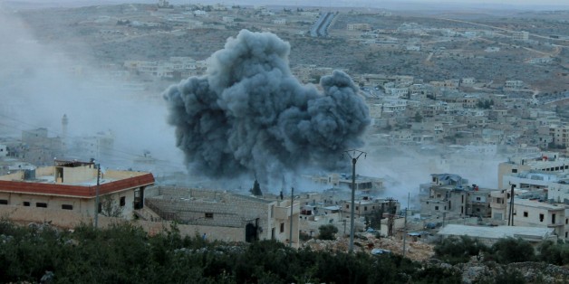 ALEPPO, SYRIA - OCTOBER 13: Smoke rises after Russian war crafts hit the Syrian opposition controlled town Daret Ezza in Aleppo, Syria on October 13, 2015. (Photo by Mamun Abu Omer/Anadolu Agency/Getty Images)