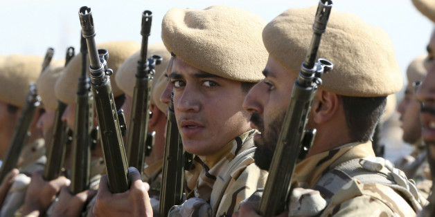 Iranian army troops conclude their march in a military parade marking the 35th anniversary of Iraq's 1980 invasion of Iran, in front of the shrine of late revolutionary founder Ayatollah Khomeini, just outside Tehran, Iran, Tuesday, Sept. 22, 2015. President Hassan Rouhani said Tuesday his countryâs military is the most reliable force to take on âterrorists in the regionâ _ a reference to the extremist Islamic State group while offering help to neighboring nations in case of fight
