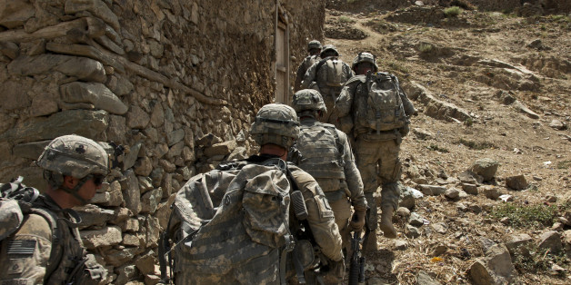 U.S. Army Soldiers of 101 Airborne Division 1st Battalion, Bush Masters (TF No Slack), assisted by Afghan National Army troops move into an over watch position during operation Strong Eagle 2, July 19.