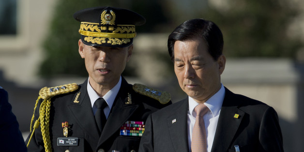 South Korean Defense Minister Han Min-koo, right, arrives at the Pentagon for the full military honors parade to welcome the visiting South Korean President Park Geun-hye to the Pentagon, Thursday, Oct. 15, 2015. (AP Photo/Manuel Balce Ceneta)