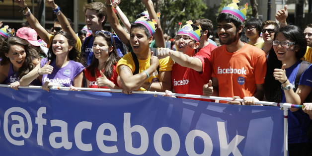 Facebook employees and family members march during the 44th annual San Francisco Gay Pride parade Sunday, June 29, 2014, in San Francisco. The lesbian, gay, bisexual, and transgender celebration and parade is one of the largest LGBT gatherings in the nation. (AP Photo/Eric Risberg)