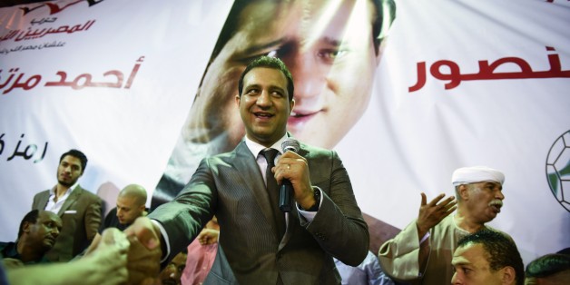 TO GO WITH AFP STORY BY JAY DESHMUKH - Ahmed Mortada Mansour, Egyptian candidate for the liberal Free Egyptians Party for the parliamentary elections, gives a speech during a campaign meeting on October 9, 2015 in the capital Cairo. Egyptians begin voting on October 18, 2015 for a new 596-member parliament, the first since the previous assembly was dissolved in June 2012. The liberal Free Egyptians Party, founded by telecoms tycoon Naguib Sawiris -- who has offered to buy an island off Greece or Italy to shelter people fleeing from war ravaged Syria -- has 231 candidates contesting across Egypt's 27 provinces. AFP PHOTO/ MOHAMED EL-SHAHED (Photo credit should read MOHAMED EL-SHAHED/AFP/Getty Images)