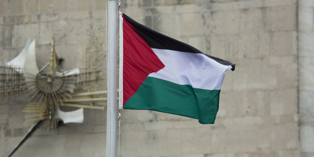 CORRECTS CAPTION TO REMOVE REFERENCE TO STATE OF PALESTINE IN ACCORDANCE WITH AP STYLE - The Palestinian flag flies in the wind after it was raised during a Rose Garden ceremony at the United Nations headquarters on Wednesday, Sept. 30, 2015. Following a vote in November 2012, the U.N. recognized Palestine as a state with non-member status and as a result it was permitted to raise its flag outside the U.N. for the first time on Wednesday. (AP Photo/Craig Ruttle)