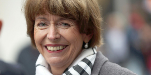 In this Friday, Oct. 16, 2015 photo independent candidate for the mayor of Cologne Henriette Reker smiles during her election campaign in Cologne, Germany. Reker was wounded in a stabbing as she campaigned on Saturday, Oct. 17, 2015, a day before an election in the western German city. (Oliver Berg/dpa via AP)