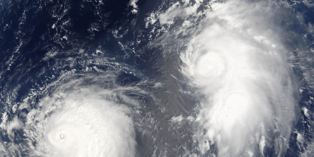 Typhon Mawar (left) and Tropical Cyclone Guchol (right) on 22 August 2005, far out in the northwestern Pacific Ocean, some 900 kilometers from Tokyo. True-colour satellite image using MODIS data., Typhoon Mawar And Tropical Cyclone Guchol, Western Pacific, In 2005, True Colour Satellite Image (Photo by Planet Observer/Universal Images Group via Getty Images)