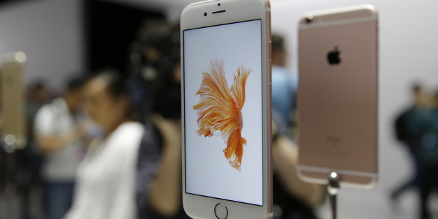 People look over the new Apple iPhone 6s models during a product display following an Apple event Wednesday, Sept. 9, 2015, in San Francisco. (AP Photo/Eric Risberg)