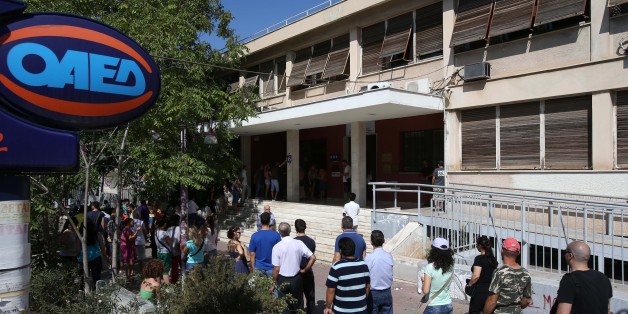 Unemployed Greeks wait in a long line outside an office of Labor Force Employment Organization (OAED) in Athens, Wednesday, Aug. 7, 2013. The country has been surviving on rescue loans from the IMF and other eurozone countries since 2010, when it lost access to long-term debt markets. Austerity measures demanded in return for the 240 billion euro ($319 billion) bailout program have hammered the economy and seen unemployment surge to 27 percent. Greece's annual economic output is around a fifth smaller than when it entered recession in 2008. (AP Photo/Thanassis Stavrakis)