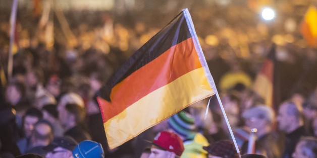 Protestors attend a demonstration of the PEGIDA (Patriotic Europeans against the Islamization of the West), marking the first anniversary of the anti-Islam group in Dresden, eastern Germany, Monday, Oct. 19, 2015. A surge of migrants to Germany over the summer has fueled a revival of fortunes for the group â whose name stands for "Patriotic Europeans against the Islamization of the West" â with crowds to weekly rallies growing steadily. Germany's top security official said the domestic