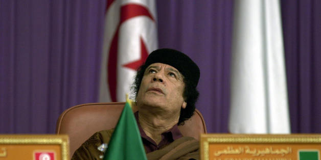 TUNIS, TUNISIA: Libyan leader Moamar Kadhafi attends the 'Dialogue 5+5' Euro-Magrabian summit, 05 December 2003, in Tunis. Leaders of five southern European and five north African countries gathered in Tunis for a summit which was also set to be marked by controversy over human rights. AFP PHOTO FETHI BELAID (Photo credit should read FETHI BELAID/AFP/Getty Images)