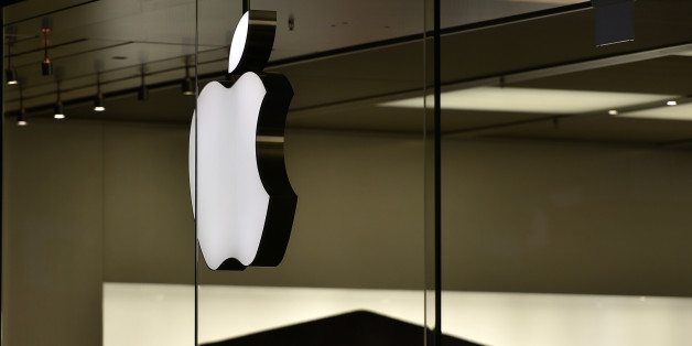The Apple logo is pictured at the Apple store in Oberhausen, Germany, as Apple Inc. launches worldwide the sales of the new iPhones on early Friday, Sept. 25, 2015. People camped in front of the store for severals days to be the first. Apple is counting on sales of their new smartphones to maintain its position as one of the most profitable, and valuable, companies in the world. (AP Photo/Martin MEissner)