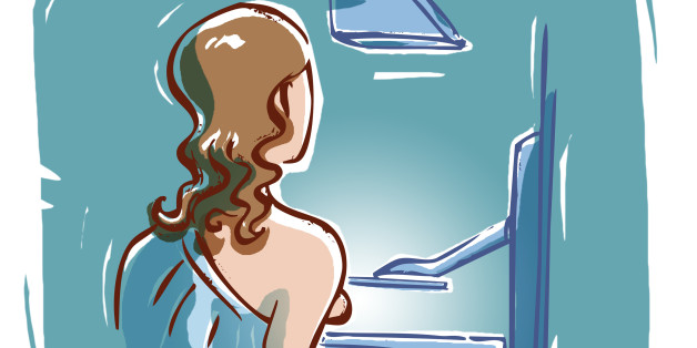 A woman getting a screening mammogram