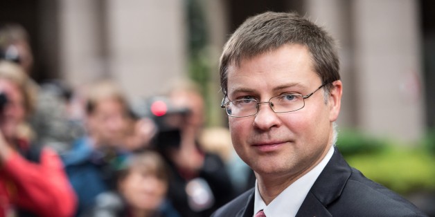 Latvian Prime Minister Valdis Dombrovskis arrives for an EU summit on Thursday, Oct. 24, 2013. A two-day summit meeting of EU leaders is likely to be diverted from its official agenda, economic recovery and migration, after German Chancellor Angela Merkel complained to U.S. President Barack Obama that U.S. intelligence may have monitored her mobile phone. (AP Photo/Geert Vanden Wijngaert)