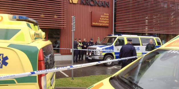 Emergency services attend the scene after a masked man attacked people with a sword, at the Kronan school in Trollhattan, near Goteborg, Sweden, Thursday Oct. 22, 2015. At least six people were injured, and the offender was shot by the police. (Stig Hedstrom / TT via AP) SWEDEN OUT
