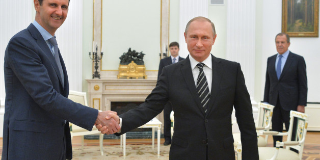 In this photo taken on Tuesday, Oct. 20, 2015, Russian President Vladimir Putin, center, shakes hand with Syrian President Bashar Assad as Russian Foreign Minister Sergey Lavrov, right, looks on in the Kremlin in Moscow, Russia. President Bashar Assad was in Moscow, in his first known trip abroad since the war broke out in Syria in 2011, to meet his strongest ally Russian leader Vladimir Putin. The two leaders stressed that the military operations in Syria_ in which Moscow is the latest and most