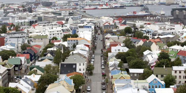 Multicolored rooftops and the harbour are seen on the city skyline in Reykjavik, Iceland, on Friday, Aug. 10, 2012. Iceland is betting its decision two years ago to force bondholders to pay for the banking system's collapse may help it rebound faster than Ireland. Photographer: Arnaldur Halldorsson/Bloomberg via Getty Images