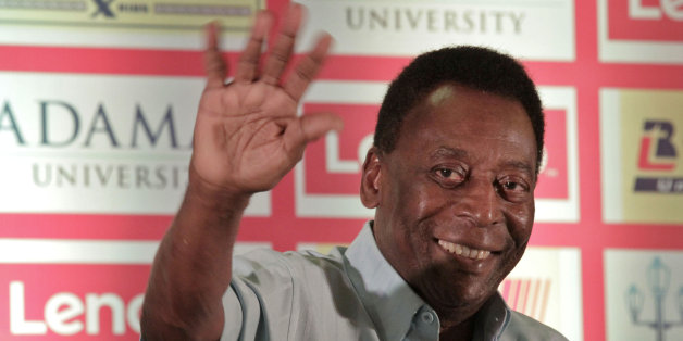 Brazilian football legend Pele greets the audience as he attends a press conference in Kolkata, India, Monday, Oct. 12, 2015. Pele is in Kolkata during a three-day visit and will also fly to the national capital New Delhi to attend the Subroto Cup 2015 football final match, according to local reports. (AP Photo/Bikas Das)