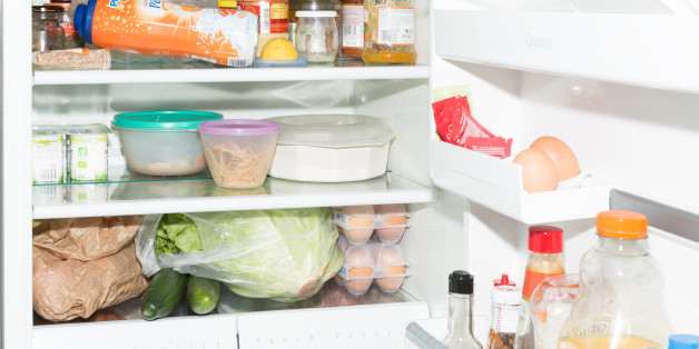 Inside fridge and the door full of food, France