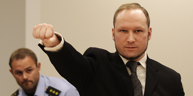 FOR USE AS DESIRED, YEAR END PHOTOS - FILE - In this Aug. 24, 2012 file photo, mass murderer Anders Behring Breivik, makes a salute after arriving in the court room at a courthouse in Oslo. Breivik, who admitted killing 77 people in Norway last year, was declared sane and sentenced to prison for bomb and gun attacks. (AP Photo/Frank Augstein, File)