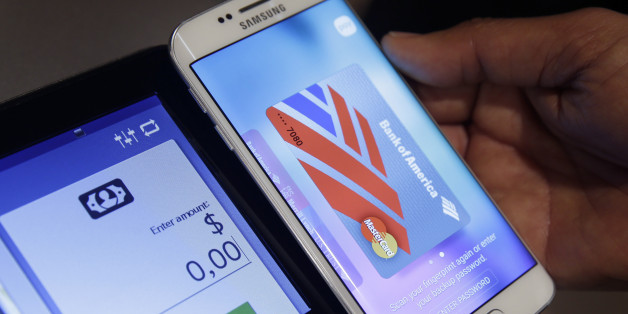 In this Aug. 6. 2015, photo, a Samsung employee demonstrates Samsung Pay using a Galaxy S6 Edge Plus in New York. (AP Photo/Seth Wenig)