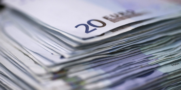 A stack of twenty euro banknotes are arranged for a photograph inside a Travelex store, operated by Travelex Holdings Ltd., in London, U.K., on Monday, Jan. 12, 2015. The euro approached a nine-year low against the dollar as European Central Bank officials fueled speculation the institution will start a program of government-bond buying as early as next week to stave off deflation. Photographer: Simon Dawson/Bloomberg via Getty Images