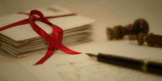 The pile of old letters (from the early 80s) was tied with the ribbon, with a pen, letter, red wax and stamp positioned to create a vintage scene on a calico backdrop. These other items were positioned so as to draw the eye to the letters and ribbon. Two images were taken, one softened using a Cokin diffuser, then combined in Photoshop with the ribbon brought out by erasing the softening effect and then enhancing the red colour.