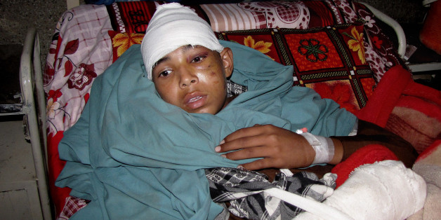 An injured Pakistani boy rests at a local hospital in Mingora, Pakistan, Monday, Oct. 26, 2015. A powerful 7.7-magnitude earthquake in northern Afghanistan rocked cities across South Asia. Strong tremors were felt in Kabul, New Delhi and Islamabad on Monday. In the Pakistani capital, walls swayed back and forth and people poured out of office buildings in a panic, reciting verses from the Quran. (AP Photo/Naveed Ali)