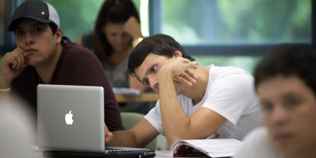 In this Sept. 9, 2013 photo, University of Miami student Gabriel Dias studies the daily lesson plan on his computer during a Spanish language class in Coral Gables, Fla. Learning a foreign language in college is a requisite for many students, but what if you grew up speaking that language, you just canât read it or write it? Thatâs the case for many second-generation immigrant children. Over the last two decades, a growing number of schools have introduced foreign language classes for