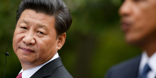 President Barack Obama, right, accompanied by Chinese President Xi Jinping, speaks at a news conference, Friday, Sept. 25, 2015, in the Rose Garden at the White House in Washington. (AP Photo/Andrew Harnik)