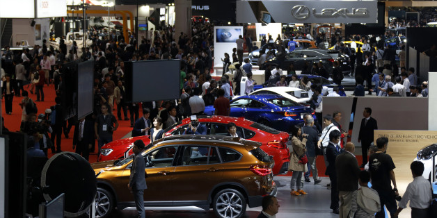 Vehicles produced by Bayerische Motoren Werke AG (BMW), front, and Toyota Motor Corp.'s Lexus unit, rear, stand on display at the Tokyo Motor Show in Tokyo, Japan, on Wednesday, Oct. 28, 2015. Toyota Motor Corp., Honda Motor Co. and Nissan Motor Co. are among automakers displaying new fuel-cell and electric vehicles at this year's Tokyo Motor Show, which runs through Nov. 8. Photographer: Tomohiro Ohsumi/Bloomberg via Getty Images