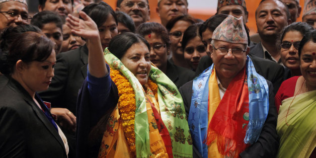 Bidhya Devi Bhandari of the Communist Party of Nepal Unified Marxist-Leninist waves her hand after she was elected as Nepal's new president in Kathmandu, Nepal, Wednesday, Oct. 28, 2015. Bhandari, 54, who has long campaigned for women's rights was elected Wednesday as Nepal's first female president. (AP Photo/Niranjan Shrestha)