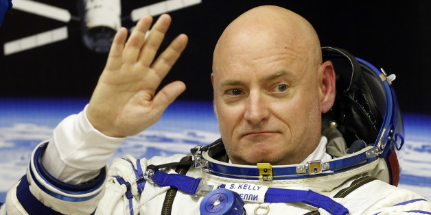 U.S. astronaut Scott Kelly, crew member of the mission to the International Space Station, ISS, gestures prior the launch of Soyuz-FG rocket at the Russian leased Baikonur cosmodrome, Kazakhstan, Friday, March 27, 2015. (AP Photo/Dmitry Lovetsky)