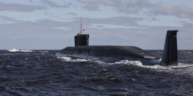 FILE - This Thursday July 2, 2009 file photo, shows a new Russian nuclear submarine, Yuri Dolgoruky, near the Sevmash factory in the northern city of Arkhangelsk, Russia. With hundreds of new aircraft, tanks and missiles rolling off assembly lines and Russian jets buzzing European skies under NATOâs wary eye, it doesnât look like Russiaâs economic woes have had any impact on the Kremlinâs ambitious military modernization program. (AP Photo/Alexander Zemlianichenko, File)