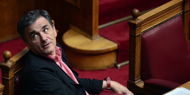 Greek Finance Minister Euclid Tsakalotos attends a debate at the Greek parliament in Athens on October 16, 2015, before voting on a new bill with additional tax hikes and reforms stemming from the country's third EU bailout, a condition for the release of bailout funds. Greece's parliament was expected to approve later today a first batch of reforms and tax cuts stemming from its third EU bailout. AFP PHOTO/ LOUISA GOULIAMAKI (Photo credit should read LOUISA GOULIAMAKI/AFP/Getty Images)