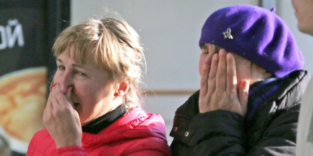 Relatives of a passenger aboard the crashed Russian airliner with 217 passengers and seven crew aboard, as people gather at Pulkovo airport in St.Petersburg, Russia, Saturday, Oct. 31, 2015. Russia's civil air agency is expected to have a news conference shortly to talk about the Russian Metrojet passenger plane that Egyptian authorities say has crashed in Egypt's Sinai peninsula. (AP Photo/Dmitry Lovetsky)