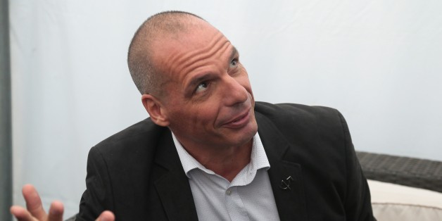 Former Greek Finance Minister Yannis Varoufakis meets with French Communist Party's secretary general at the Fete de l'Humanite 2015 (Humanity Festival) in La Courneuve, near Paris, on September 12, 2015. AFP PHOTO/JACQUES DEMARTHON (Photo credit should read JACQUES DEMARTHON/AFP/Getty Images)