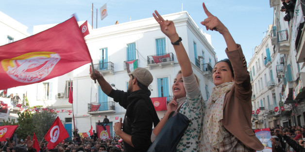 Members of the leftist UGTT union commemorate the 1955 assassination of a historic member before they were attacked by the League for Protection of the Revolution, Tuesday, Dec.4, 2012 in Tunis. League members are considered to be close to the Ennahda Party, which dominates Tunisiaâs post-revolution coalition government (AP Photo/Amine Landoulsi)