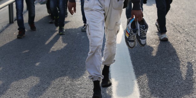 ISTANBUL, TURKEY - SEPTEMBER 21: Syrian refugees hoping to cross the Turkish border into Greece or Bulgaria, walk along the TEM motorway towards northwestern Edirne province on September 21, 2015 in Istanbul, Turkey. Thousands of refugees continued to flock to Edirne, which borders Greece and Bulgaria, in an attempt to cross further into Europe. (Photo by Isa Terli/Anadolu Agency/Getty Images)