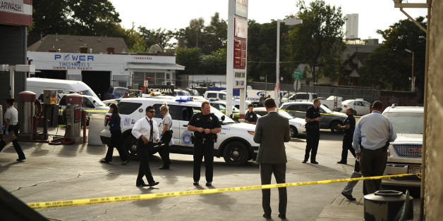 DENVER, CO. - SEPTEMBER 22, 2015: Police cover the entire area where 3 were wounded in a shooting at the corner of Lawrence and Downing in the parking lot near Jenny's Market in Denver September 22, 2015 Denver, CO (Photo By Joe Amon/The Denver Post via Getty Images)