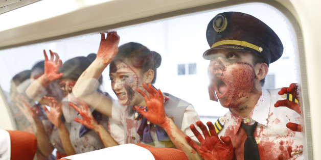 CHENGDU, CHINA - OCTOBER 30: (CHINA OUT) Students of Sichuan Southwest Vocational College of Civil Aviation perform horrible fight on the B737-800 during a training lesson on October 30, 2015 in Chengdu, Sichuan Province of China. Students of Sichuan Southwest Vocational College of Civil Aviation made up to perform in a horrible fight on the B737-800 airplane during a training lesson on Friday ahead of the Halloween. (Photo by ChinaFotoPress/ChinaFotoPress via Getty Images)