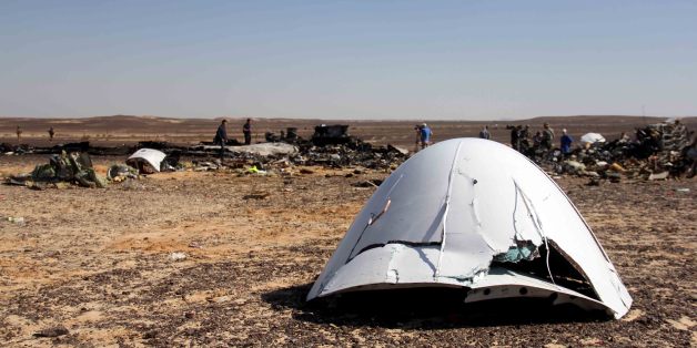 Debris of a Russian airplane is seen at the site a day after the passenger jet bound for St. Petersburg, Russia, crashed in Hassana, Egypt, on Sunday, Nov. 1, 2015. The Metrojet plane, bound for St. Petersburg in Russia, crashed 23 minutes after it took off from Egypt's Red Sea resort of Sharm el-Sheikh on Saturday morning. The 224 people on board, all Russian except for four Ukrainians and one Belarusian, died. (AP Photo)