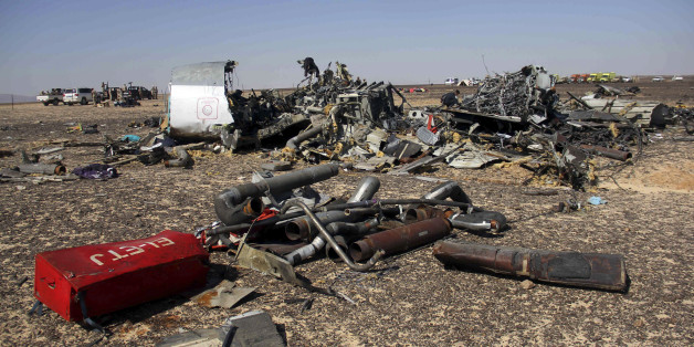 Egyptian security forces stand guard by debris of a Russian airplane at the site a day after the passenger jet bound for St. Petersburg, Russia crashed in Hassana, Egypt, on Sunday, Nov. 1, 2015. The Metrojet plane, bound for St. Petersburg in Russia, crashed 23 minutes after it took off from Egypt's Red Sea resort of Sharm el-Sheikh on Saturday morning. The 224 people on board, all Russian except for four Ukrainians and one Belarusian, died. (AP Photo)