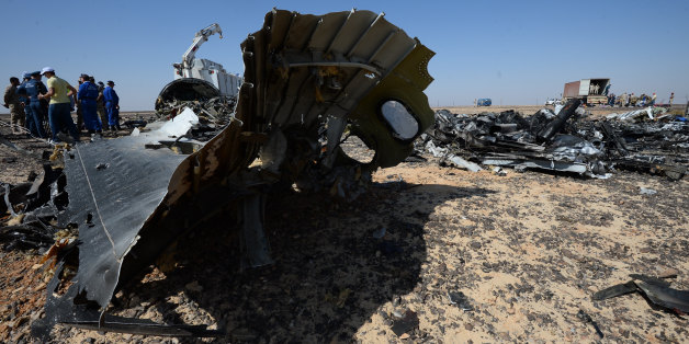 In this Russian Emergency Situations Ministry photo, made available on Monday, Nov. 2, 2015, Russian Emergency Ministry experts work at the crash site of a Russian passenger plane bound for St. Petersburg in Russia that crashed in Hassana, Egypt's Sinai Peninsula, on Monday, Nov. 2, 2015. A Russian cargo plane on Monday brought the first bodies of Russian victims home to St. Petersburg, from Egypt.(Russian Ministry for Emergency Situations photo via AP)