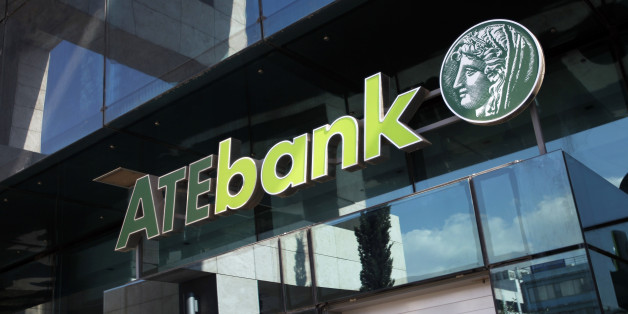 The logo of the Agricultural Bank of Greece (ATE) sits outside the entrance to the company's headquarters in Athens, Greece, on Thursday, March 29, 2012. Greek banks got an extension of the deadline to report full-year earnings, to allow them to fully account for losses from a debt swap and additional provisions following a review of loan portfolios. Photographer: Kostas Tsironis/Bloomberg via Getty Images