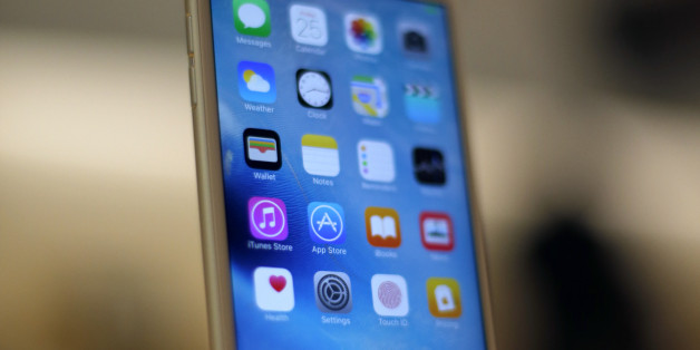 A new Apple iPhone 6S is displayed at an Apple store on Chicago's Magnificent Mile, Friday, Sept. 25, 2015, in Chicago. (AP Photo/Kiichiro Sato)