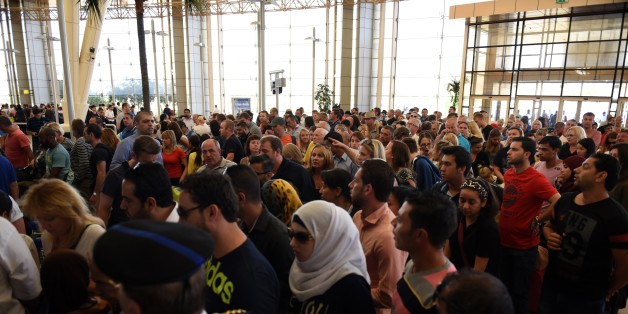Tourists queue at the airport in Egypt's Red Sea resort of Sharm El-Sheikh on November 6, 2015. Britain moved to repatriate thousands of tourists from Egypt's Sharm el-Sheikh after warnings a 'terrorist bomb' may have brought down a Russian jet that took off from the resort, as several nervous airlines scrapped their flights. AFP PHOTO / MOHAMED EL-SHAHED (Photo credit should read MOHAMED EL-SHAHED/AFP/Getty Images)