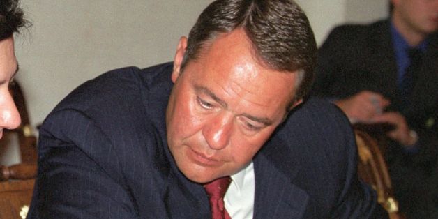 MOSCOW, RUSSIA: Telecommunication Minister Leonid Reiman (L) and Minister of Press, Television and Radio Broadcasting, Mikhail Lesin (R), confer over documents 28 August 2000 during a meeting, headed by Russian President Vladimir Putin, at the Kremlin in Moscow to discuss the situation concerning the fire at the main TV broadcasting tower in Ostankino. Putin said 28 August 2000 that only an improved economy can help avoid such accidents. AFP PHOTO (Photo credit should read AFP/Getty Images)