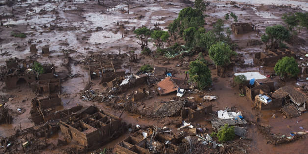 Aerial view of the debris after a dam burst on Thursday, at the small town of Bento Rodrigues in Minas Gerais state, Brazil, Friday, Nov. 6, 2015. Brazilian rescuers searched feverishly Friday for possible survivors after two dams burst at an iron ore mine in a southeastern mountainous area. (AP Photo/Felipe Dana)