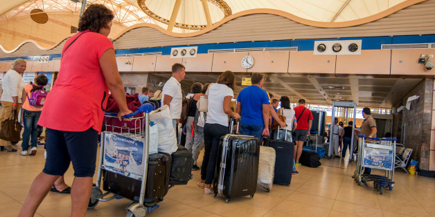 Passengers line up to depart from Sharm el-Sheikh Airport hours after a Russian aircraft carrying 224 people, including 17 children, crashed about 20 minutes after taking off from Sharm el-Sheikh, a Red Sea resort popular with Russian tourists, in south Sinai, Egypt, Saturday, Oct. 31, 2015. A Russian Metrojet plane crashed Saturday morning in a mountainous region in the Sinai after taking off from Sharm el-Sheikh, killing all 224 people aboard. A senior aviation official said the pilot had radi