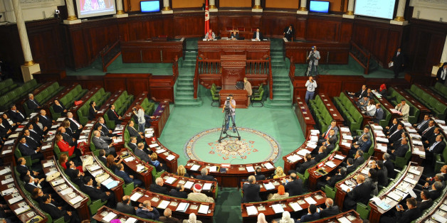 Tunisian parliament members gather during the inaugural session of the newly elected Tunisian parliament in Tunis, Tuesday, Dec. 2, 2014. This is the first national assembly meeting since the October 2014 legislative elections that resulted in a victory for opposition secular parties. (AP Photo/Hassene Dridi)